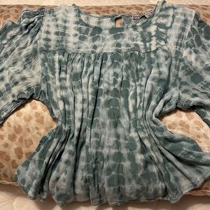 Gypsies and moon dust blue and white blouse.